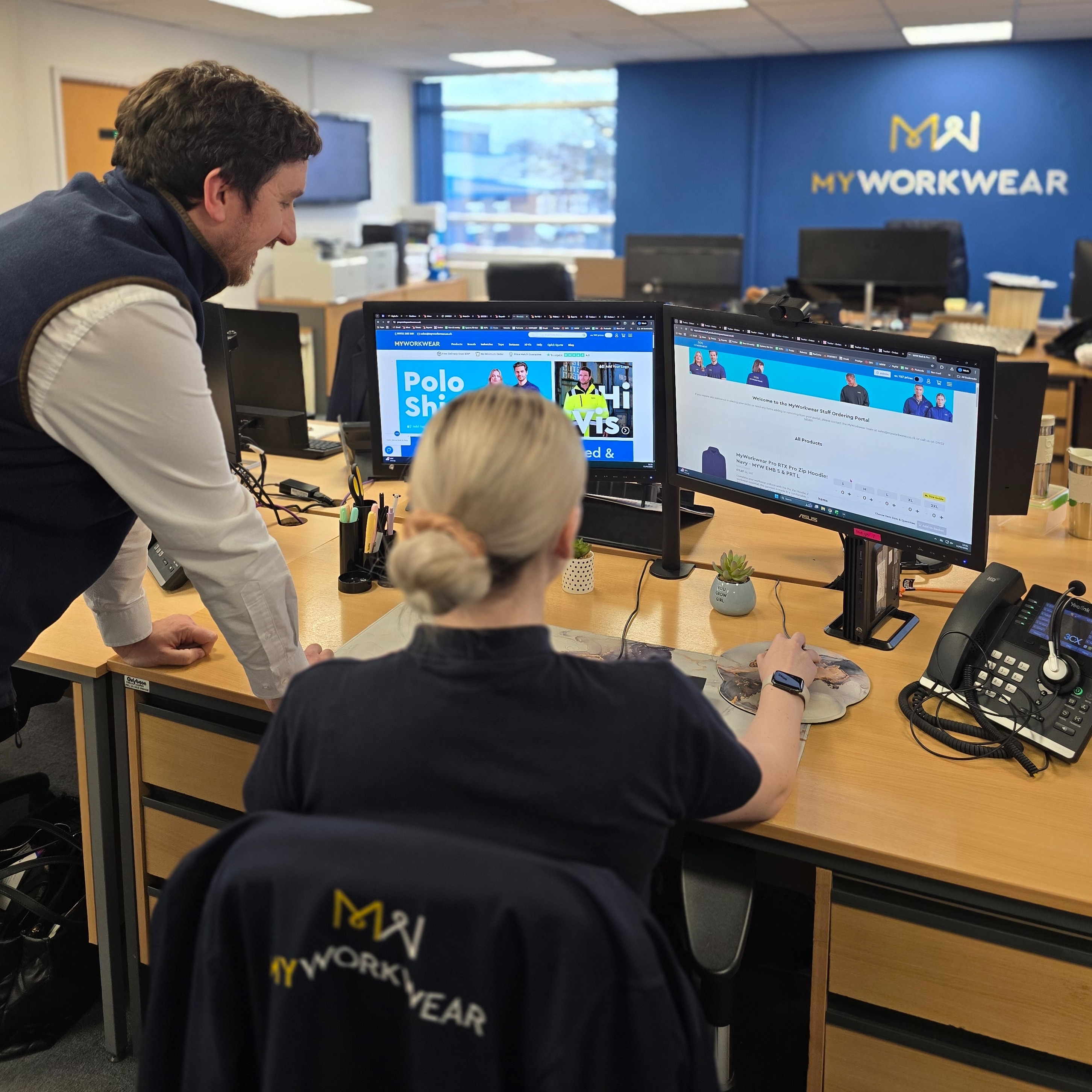 MyWorkwear Employees Looking At New Website On Screen