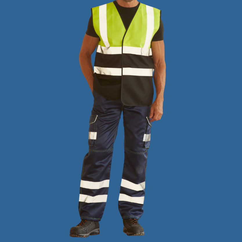 Man wearing work boots, blue hi-vis trousers, black t-shirt and black and yellow hi-vis. 